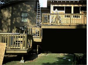 Standard deck replaced with three level deck and a sun-room.