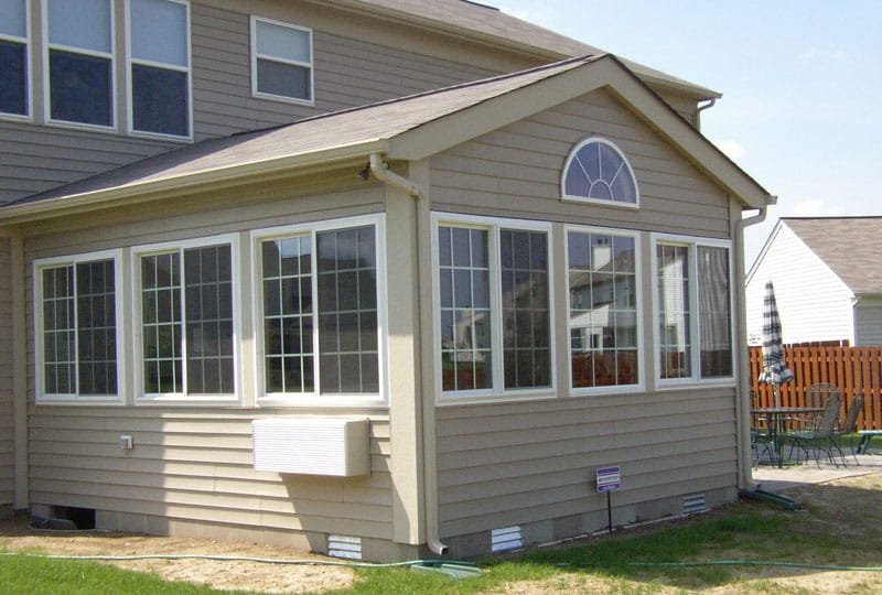 Addition with gable roof, gable window with several windows